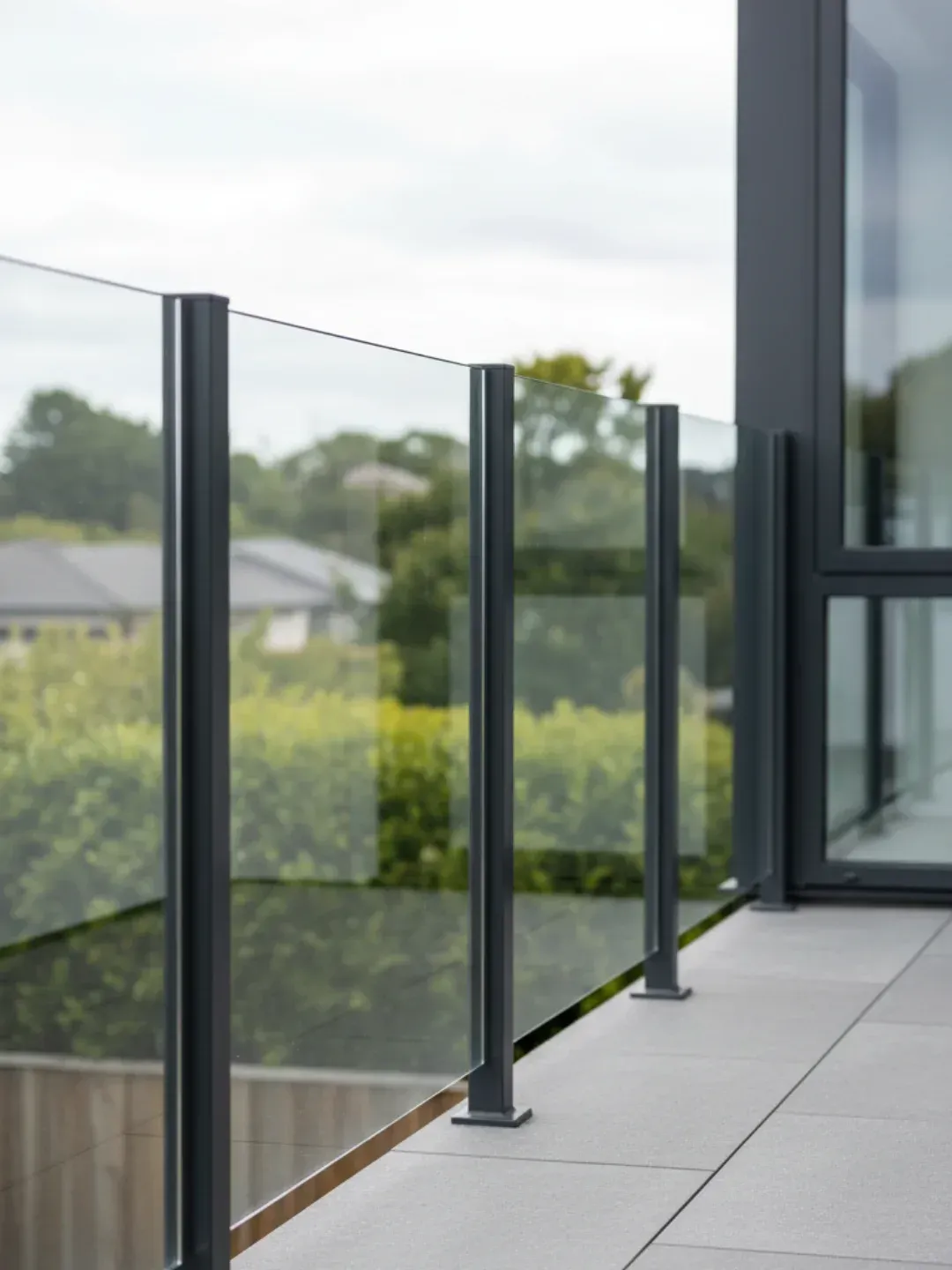 Semi-frameless glass balustrades South Brisbane with powder-coated aluminium posts and glass infill panels for robust compliance.